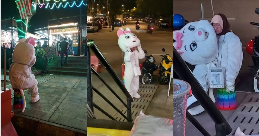 馬來西亞吉隆坡一名男子在逛夜市期間，看到一名身穿白色人偶裝的人士走到一旁脫下頭套，裡面竟然是一名神情落魄的婦人。（圖／翻攝自臉書／Roslan Salleh）